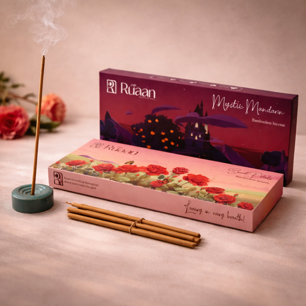 Ráñn incense sticks and packaging on a light surface with flowers in the background