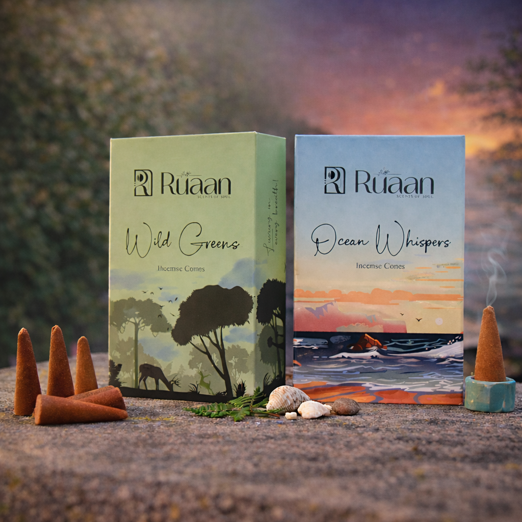 Two boxes of Ruaan incense cones, one labeled 'Wild Greens' and the other 'Ocean Whispers', with incense cones on a scenic background.
